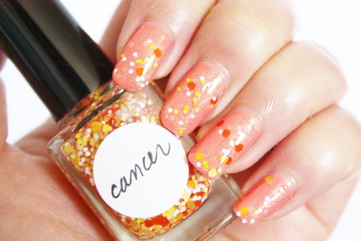 Cancer is a beautiful blend of multi-sized orange, peach, banana yellow, white, and iridescent glitter in a clear base